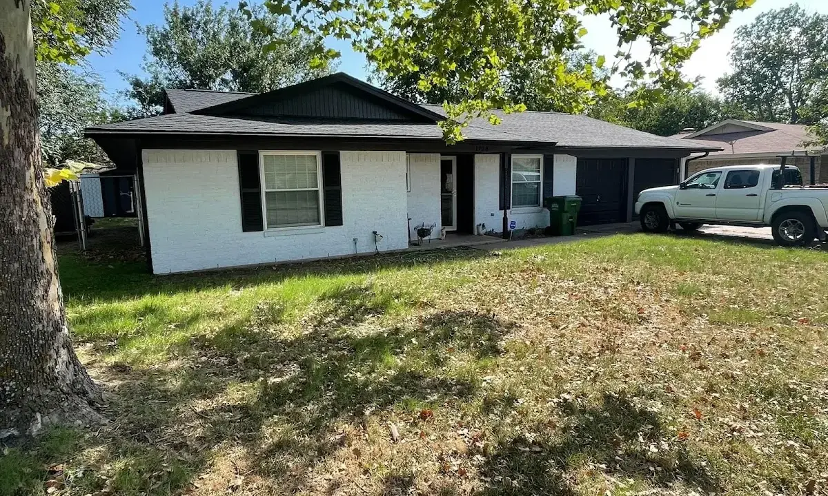 Professional roofing crew working on a residential roof in Bainbridge Island